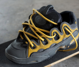 black and yellow wide skateboarding shoes