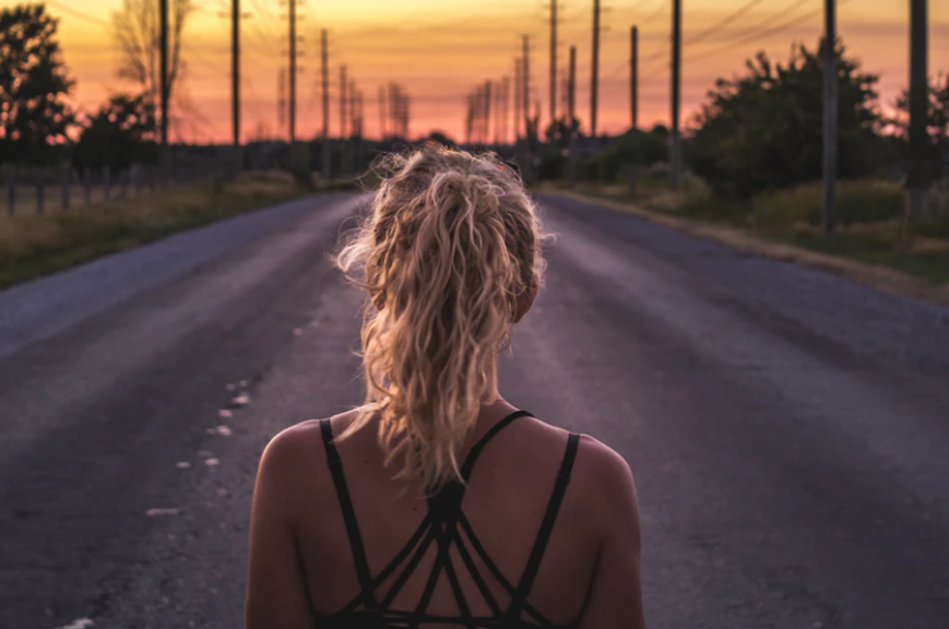 Woman standing in the middle of the road