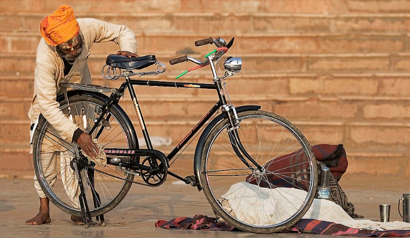 Man cleaning a bike